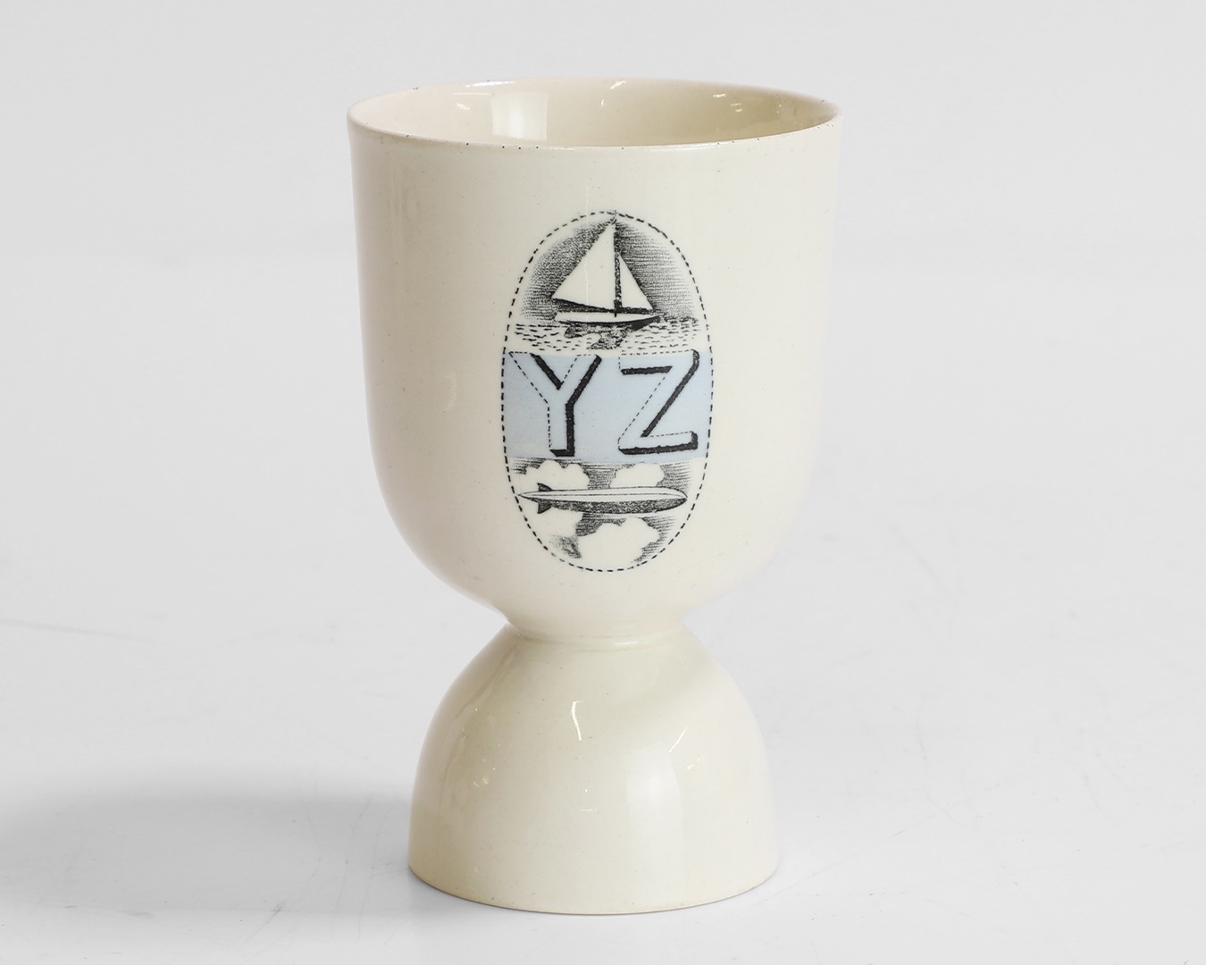 Eric Ravilious (1903-1942) for Wedgwood, a blue 'Alphabet' egg cup (Sold for £2,860)